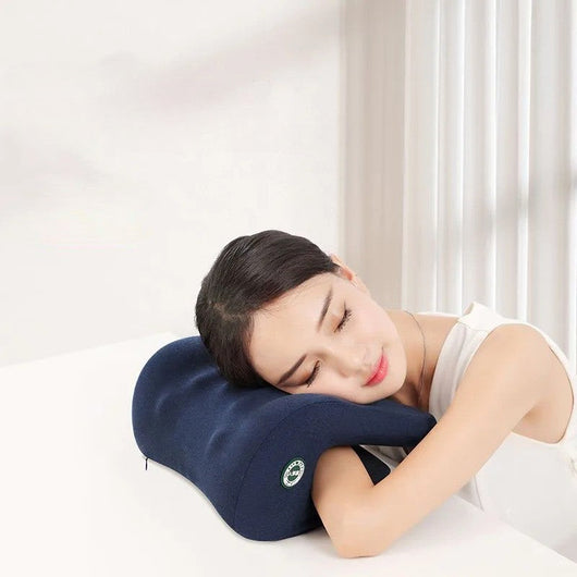 Woman resting her head on a navy blue Neck Pillow For Chair providing ergonomic support