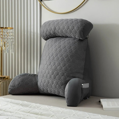 Gray getblissyneck Reading Pillow with adjustable headrest and armrests on bed for back support